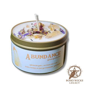 Product image of the Empowered Abundance candle with Citrine, Rose, Mallow, and Hibiscus on a white background, fragranced with notes of Lavender, Grapefruit, Patchouli, Amber, and Sandalwood
