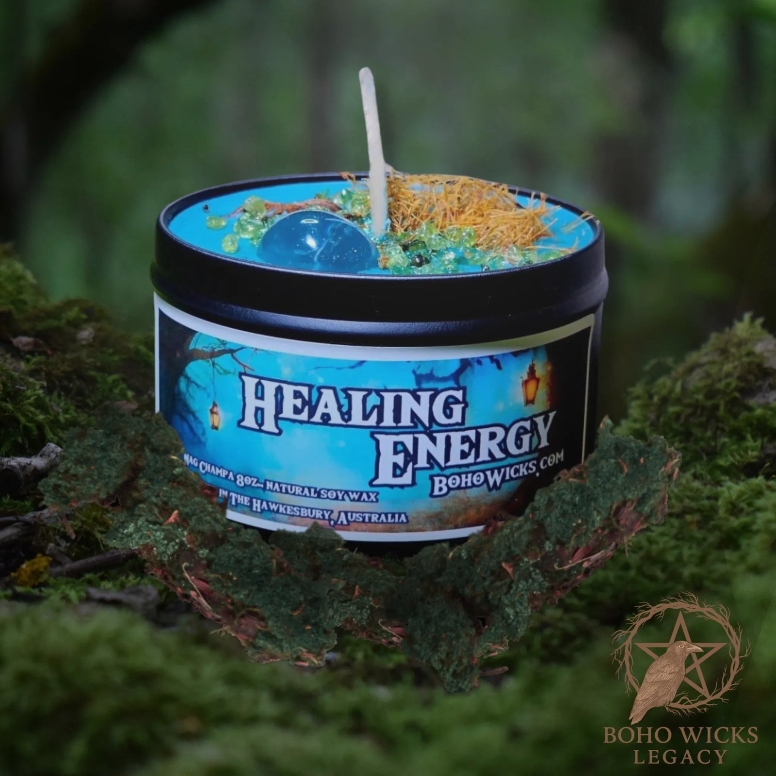 Forest setting photo of the Healing Energy candle with Clear Quartz, Peridot, Cats Claw, St. John's Wort, and Star Anise surrounded by moss, fragranced with Nag Champa

