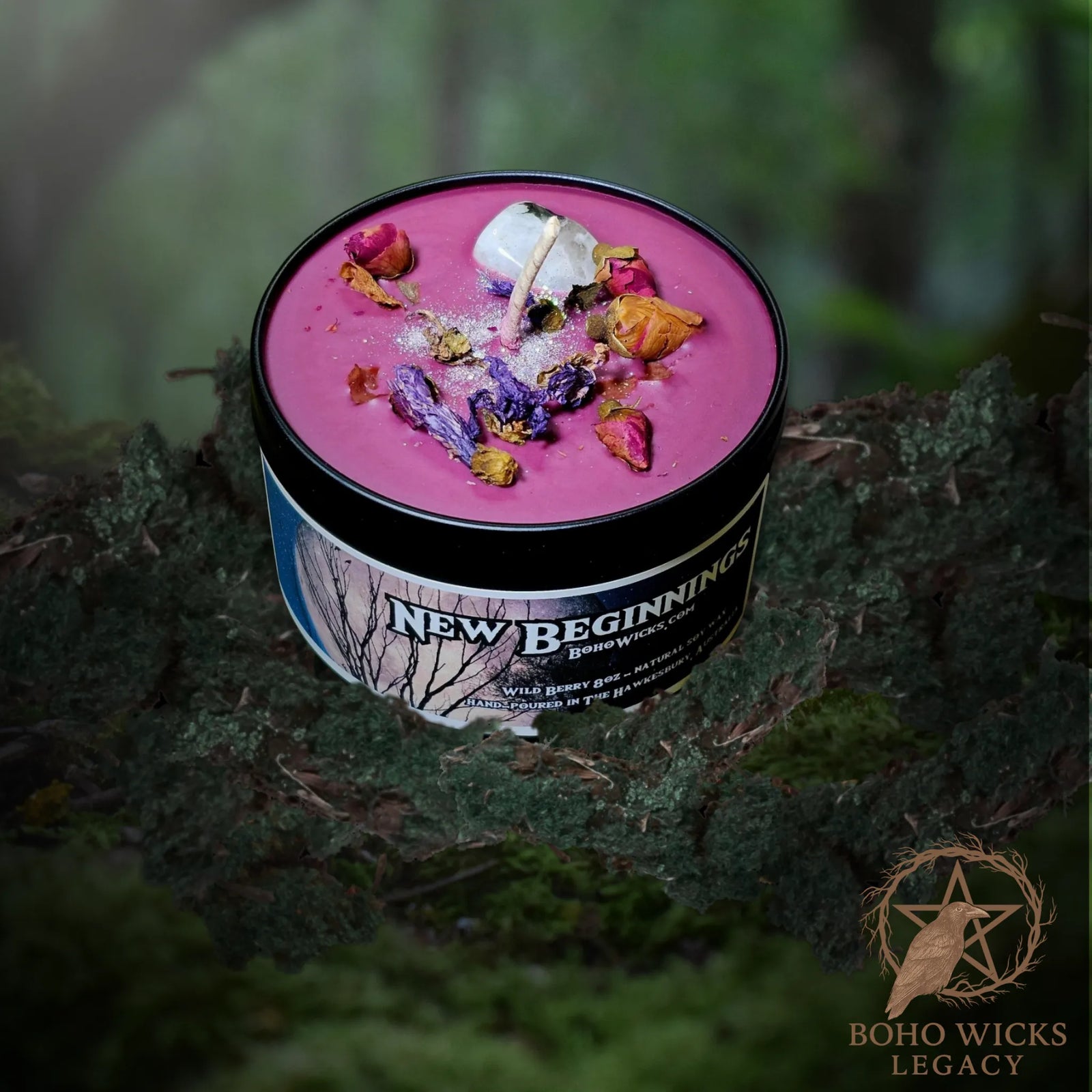 Forest setting photo of the New Beginnings candle with Moonstone, Mallow Flowers, and Rosebuds surrounded by moss, fragranced with Wild Berry