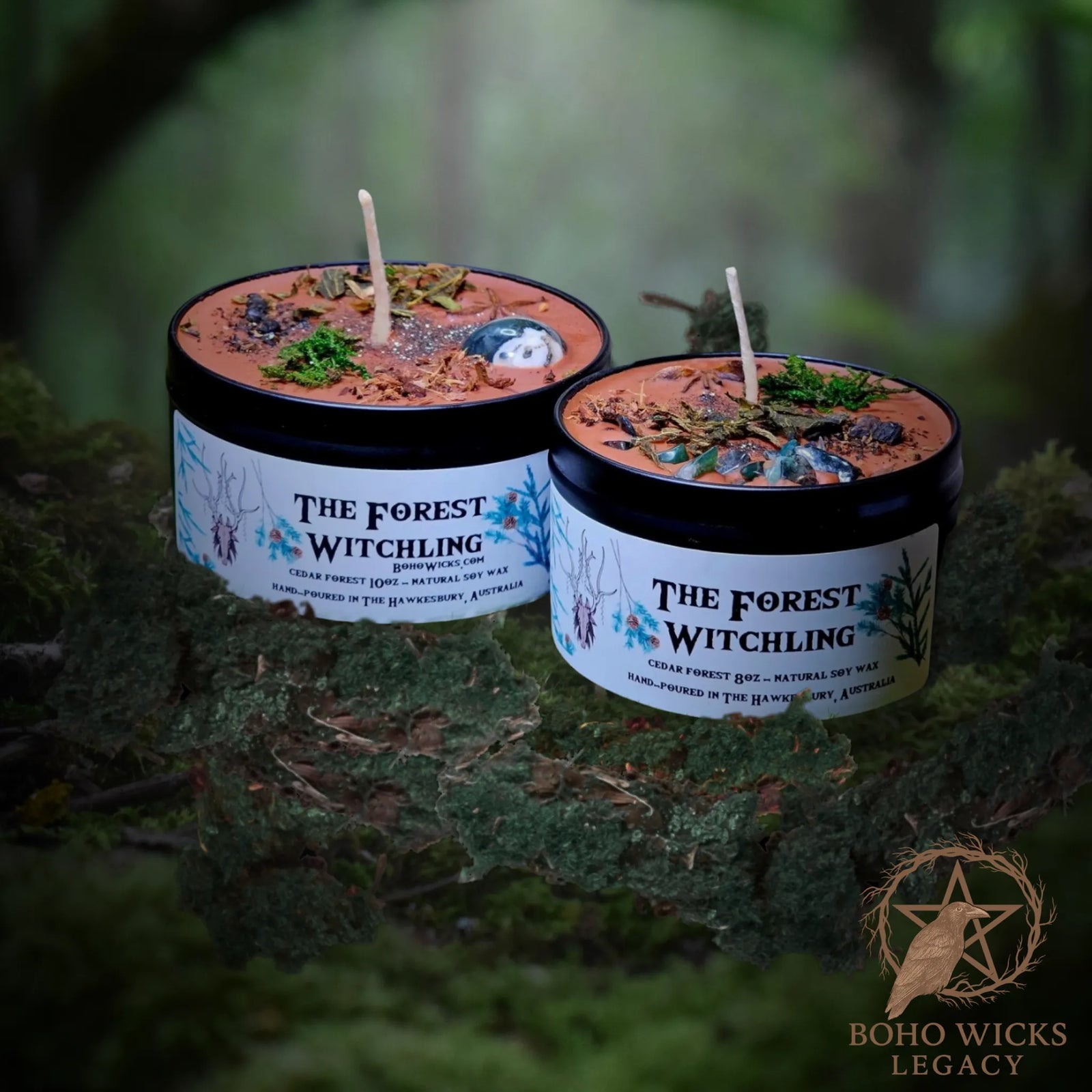 Forest setting photo of The Forest Witchling candle with Moss Agate, Oak Bark, Comfrey Root, Nettle Leaf, and Star Anise surrounded by moss, fragranced with Cedar Forest