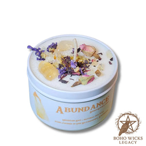 Product image of the Empowered Abundance candle with Citrine, Rose, Mallow, and Hibiscus on a white background, fragranced with notes of Lavender, Grapefruit, Patchouli, Amber, and Sandalwood