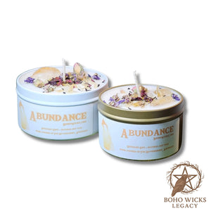 Product image of the Empowered Abundance candle with Citrine, Rose, Mallow, and Hibiscus on a white background, fragranced with notes of Lavender, Grapefruit, Patchouli, Amber, and Sandalwood