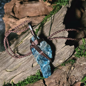 Apatite crystal tied with brown cord and leather detail