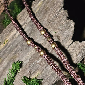 Obsidian arrowhead crystal with deep earthy texture