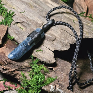 Blue kyanite jewellery on weathered timber and greenery