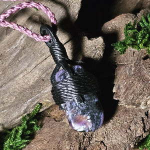 Close-up of charoite necklace showing texture and wrapping