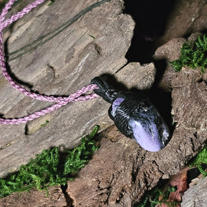 Handwoven pendant featuring charoite for emotional healing