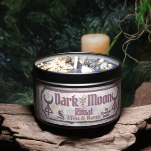 Dark Moon Ritual Candle by Moss & Raven – 8oz black wax candle dressed with crystals and herbs, fragranced with Moonlight Amber