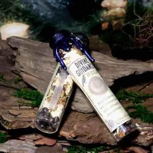 Crystals and herbs inside Divine Guidance Spell Jar