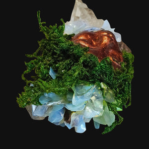 Overhead view showing Opalite and Clear Quartz nestled in moss and driftwood — handmade by Moss & Raven.