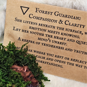 Forest Guardian sculpture with amethyst, rose quartz, and moss on driftwood