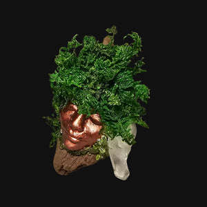 Front view of Forest Guardian resting on driftwood with Peridot stones and Clear Quartz cluster — witchcrafted decor for renewal and grounding.