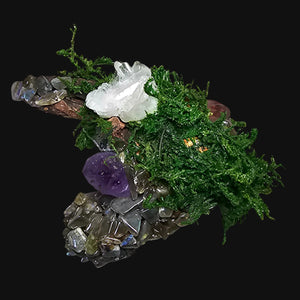 Detail view of Amethyst and Quartz cluster — grounding driftwood base with vibrant moss textures by Moss & Raven.