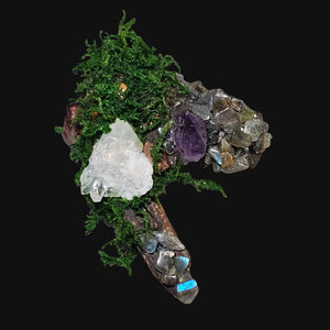 Back view showing moss and driftwood form — natural materials used in this handmade altar sculpture.