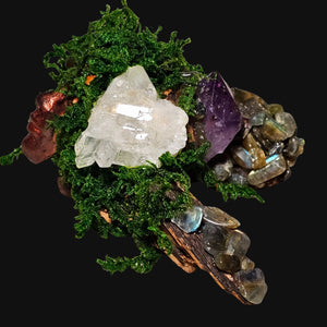 Side view of Forest Guardian showing Amethyst chips and Clear Quartz rising from moss and driftwood — elemental art for clarity and trust.
