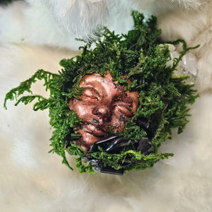 Moss covered guardian sculpture with black tourmaline and snowflake obsidian