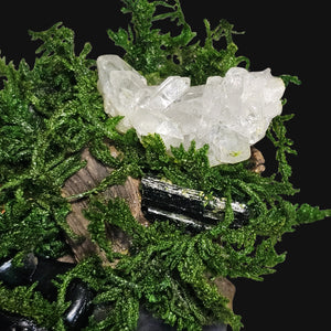 Handmade Forest Guardian art on dark background — copper face with moss, tourmaline, and obsidian, channeling strength through stillness.