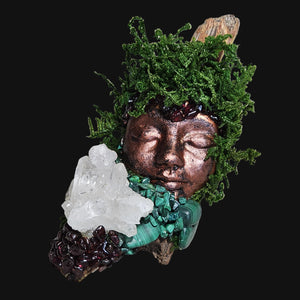 Hand-sculpted Forest Guardian featuring earthy tones of driftwood and copper, accented by Garnet, Malachite, and Clear Quartz crystals.