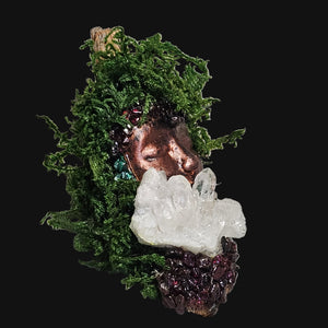 Side view of Forest Guardian altar art — copper-bronze sculpture with Malachite and Garnet stones surrounding a Clear Quartz cluster.