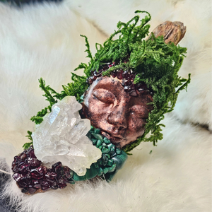 Spiritual guardian sculpture featuring malachite and garnet crystals