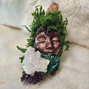Ritual guardian artwork featuring quartz cluster and sculpted copper face