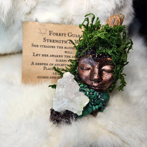 Forest Guardian sculpture with malachite, garnet, and quartz cluster on driftwood