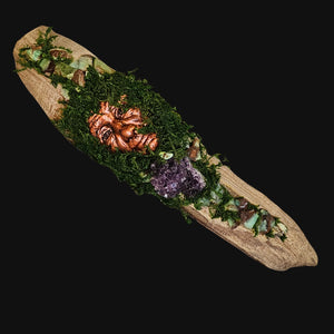 Forest Guardian sculpture with masculine copper face surrounded by moss, Chrysoprase, and Amethyst on driftwood.