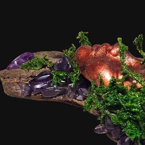 Front view of Forest Guardian resting on driftwood with Amethyst stones and Clear Quartz cluster — witchcrafted decor for calm and clarity.