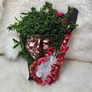 piritual guardian sculpture featuring red coral and clear quartz