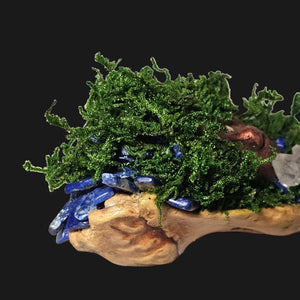 Moss-covered Forest Guardian featuring a copper face, Lapis Lazuli stones, and Clear Quartz crystal — one-of-a-kind handmade altar decor.