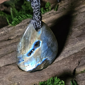 Teardrop labradorite pendant with vivid blue flash on grey cord