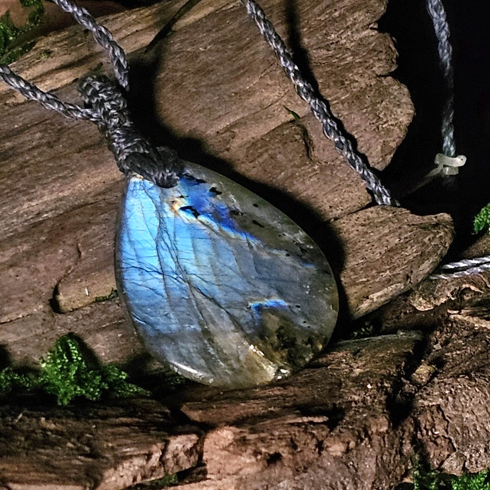 Close-up of blue flash labradorite stone in macrame wrap