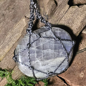 Rear view of teardrop labradorite pendant with woven cord detail