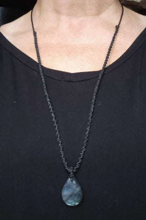 Handcrafted Labradorite teardrop talisman necklace with black cord shown at longest wearable length