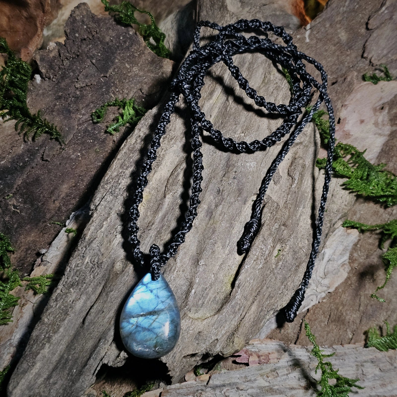 Labradorite crystal pendant showing natural blue iridescence