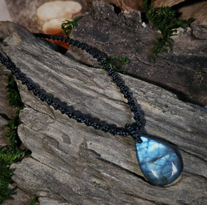 Handcrafted Labradorite pendant with deep blue flash and woven cord