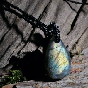 Labradorite crystal pendant showing natural blue and green iridescence