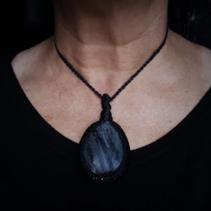 Large Labradorite pendant with black woven cord worn at shortest adjustable neck length