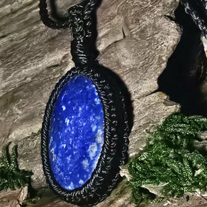 Deep blue lapis lazuli with natural texture and black threading