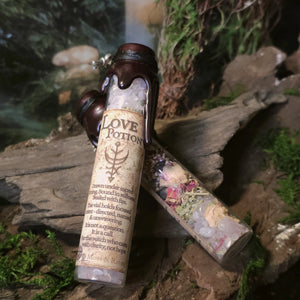 Love Potion Spell Jar with rose quartz, herbs, and red sealing wax.