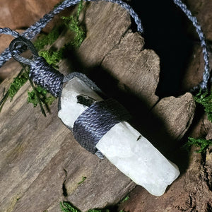 Natural moonstone necklace photographed on bark and moss