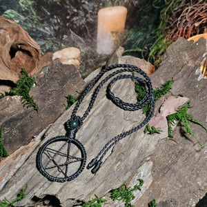 Black macrame pentacle pendant with moss agate detail in ritual setting