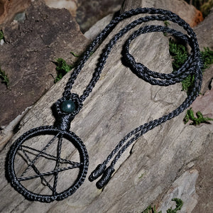 Black macrame pentacle pendant with moss agate detail in ritual setting