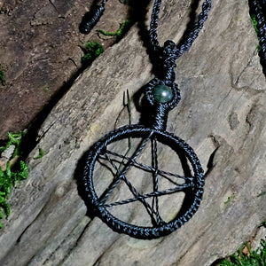 Handmade witchcraft pendant featuring woven pentacle symbol and moss agate