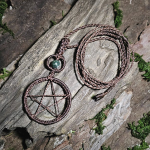 Handmade witchcraft pendant featuring woven pentacle symbol and moss agate bead