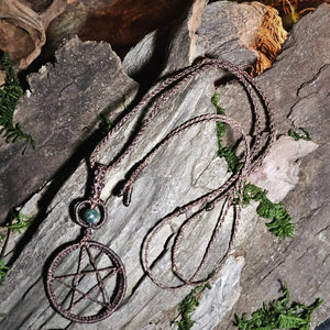 Brown woven pentacle necklace created for grounding and protective ritual work