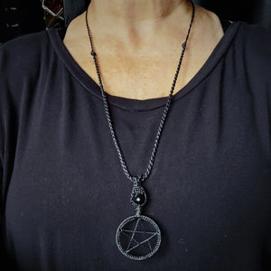 Black pentacle ritual talisman necklace with adjustable cord shown at longest wearable length #1