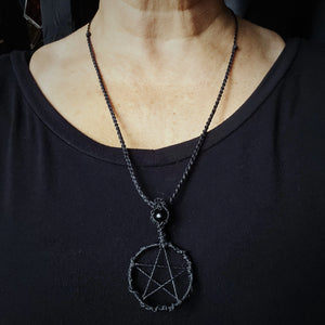 Handcrafted black pentacle necklace with obsidian bead displayed at extended cord length #2