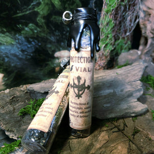 Protection Spell Jar displayed on wood with nettle and vervain