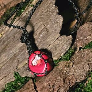Woven red coral pendant with raw natural centre